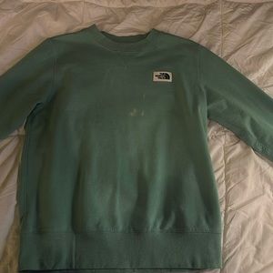 The North Face turquoise crewneck woman’s size small.